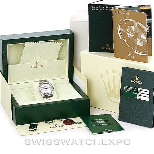 The image shows a Rolex Air-King 114200 Men's Stainless Steel Silver Dial 114200 Men's Stainless Steel Silver Dial watch in its box with accompanying booklets, warranty card, and cleaning cloth, all viewed at an angle.