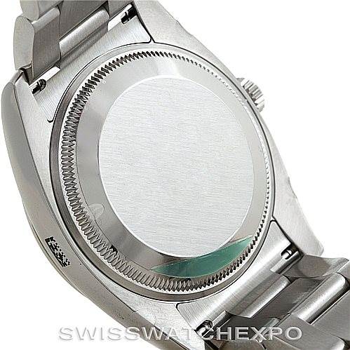 This image shows the back case and part of the bracelet of the Rolex Air-King 114200 Men's Stainless Steel Silver Dial 114200 Men's Stainless Steel Silver Dial watch from an angled view.