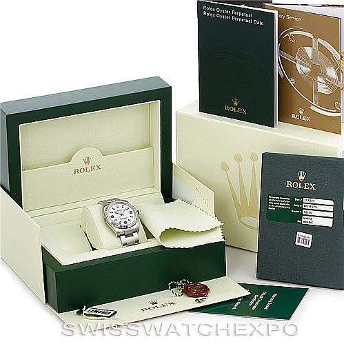 The image shows a Rolex Air-King 114234 Men's Stainless Steel White Dial 114234 Men's Stainless Steel White Dial watch with its box, warranty card, tags, and manuals from a front angle.