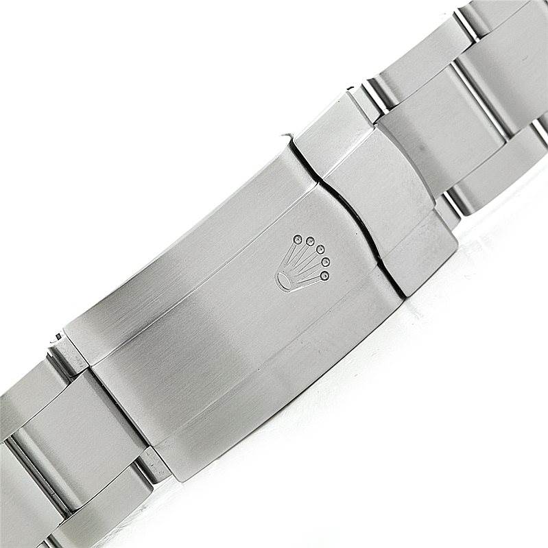 The image shows the stainless steel clasp and part of the bracelet of a Rolex Air-King 114200 Men's Stainless Steel White Dial 114200 Men's Stainless Steel White Dial watch viewed up close.