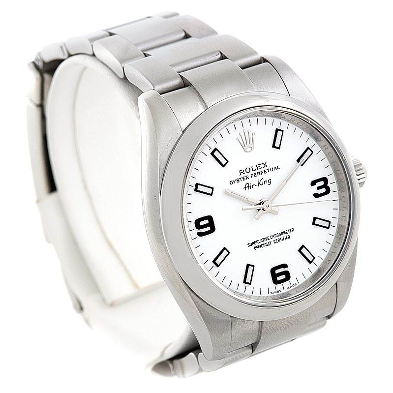 The image shows a front angled view of the Rolex Air-King 114200 Men's Stainless Steel White Dial 114200 Men's Stainless Steel White Dial watch, featuring its dial, bezel, and part of the bracelet.