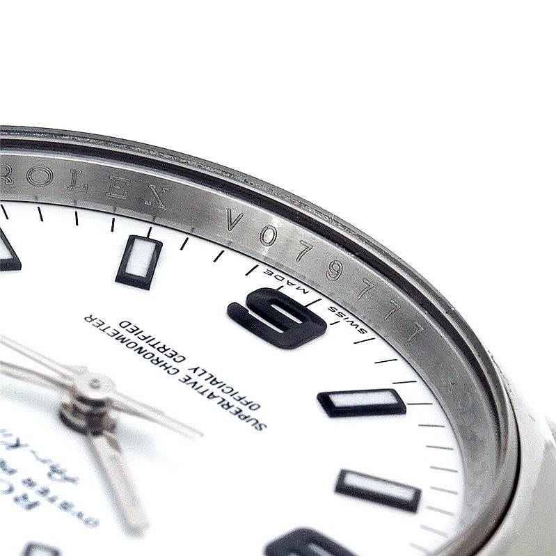 The image shows a close-up of the dial and the rehaut (inner bezel) of a Rolex Air-King 114200 Men's Stainless Steel White Dial 114200 Men's Stainless Steel White Dial watch, including the engraved serial number.