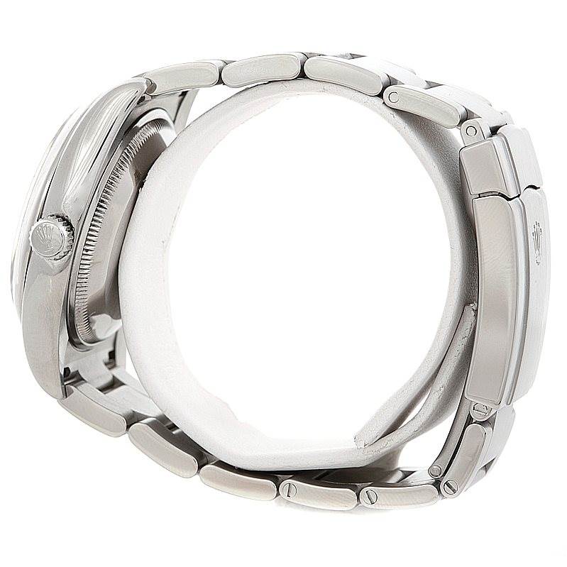 This image shows a side view of the Rolex Air-King 114200 Men's Stainless Steel White Dial 114200 Men's Stainless Steel White Dial watch, focusing on the bracelet, clasp, and case.