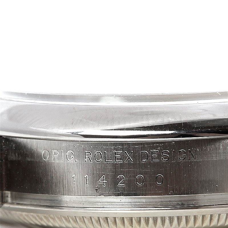 This image shows a close-up of the reference number and branding on the case side of a Rolex Air-King 114200 Men's Stainless Steel White Dial 114200 Men's Stainless Steel White Dial watch.