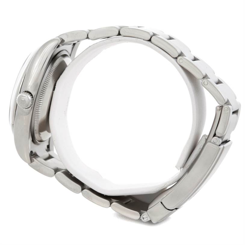 The image shows a side view of a Rolex Air-King 114200 Men's Stainless Steel Silver Dial 114200 Men's Stainless Steel Silver Dial watch, highlighting the crown, case, and bracelet.