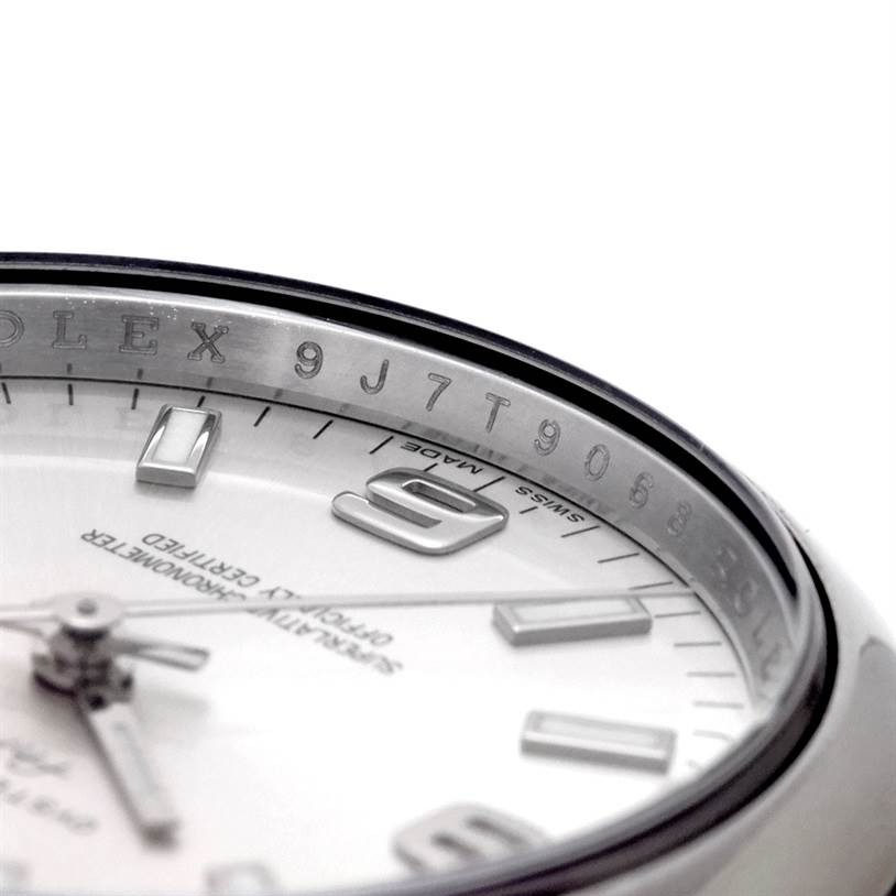 The image shows a close-up angle of the dial and inner bezel of a Rolex Air-King 114200 Men's Stainless Steel Silver Dial 114200 Men's Stainless Steel Silver Dial watch, highlighting the hour markers and engraving.