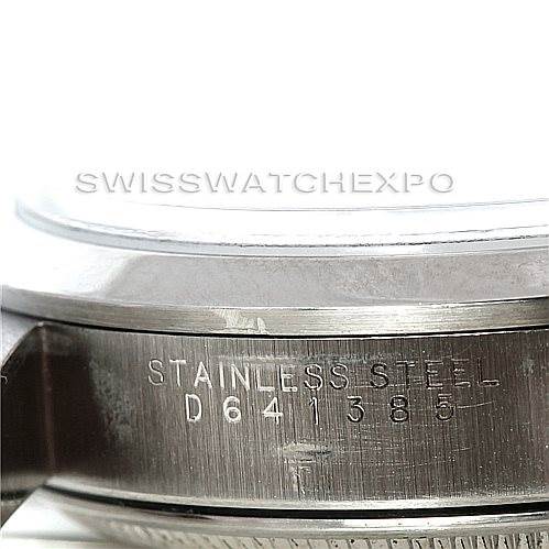 The image shows a close-up of the side of the Rolex Air-King 14000 Men's Stainless Steel Black Dial 14000 Men's Stainless Steel Black Dial watch case with the serial number and "Stainless Steel" engraved on it.