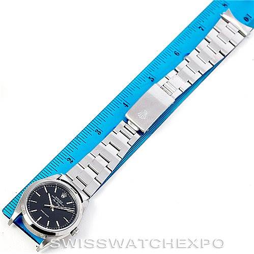 This image shows the Rolex Air-King 14000 Men's Stainless Steel Black Dial 14000 Men's Stainless Steel Black Dial watch laid flat with a ruler for size reference.