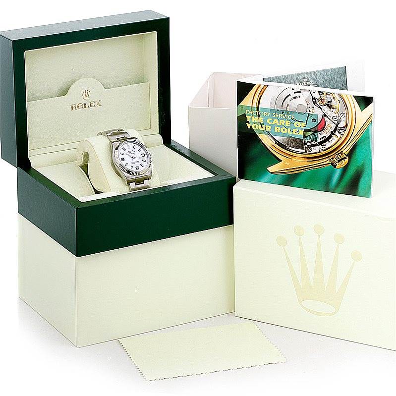 The image shows a Rolex Air-King 114234 Men's Stainless Steel White Dial 114234 Men's Stainless Steel White Dial watch in its open box with additional packaging and booklets.