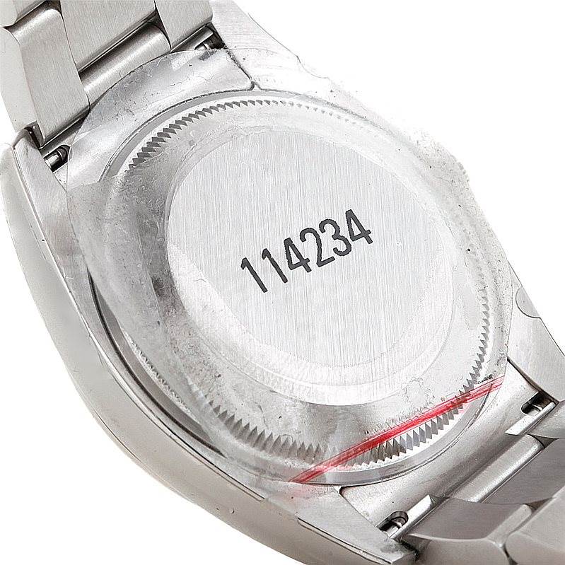 The image shows the back case and part of the bracelet of a Rolex Air-King 114234 Men's Stainless Steel White Dial 114234 Men's Stainless Steel White Dial watch, displaying the model number 114234.