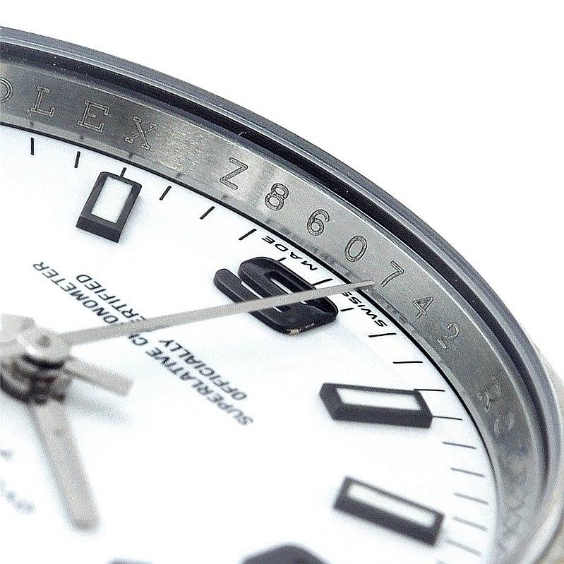 This close-up angle shows the dial and partial bezel of a Rolex Air-King 114234 Men's Stainless Steel White Dial 114234 Men's Stainless Steel White Dial watch.