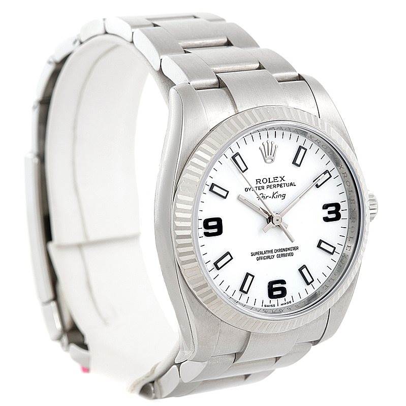 This image shows an angled view of the Rolex Air-King 114234 Men's Stainless Steel White Dial 114234 Men's Stainless Steel White Dial watch, prominently displaying its dial, bezel, and bracelet. 