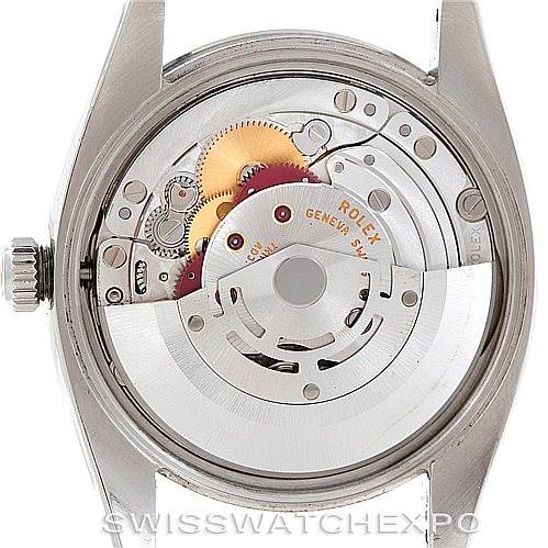 The image shows the back view of the Rolex Air-King 114200 Men's Stainless Steel Blue Dial 114200 Men's Stainless Steel Blue Dial model, revealing its inner mechanical movement.