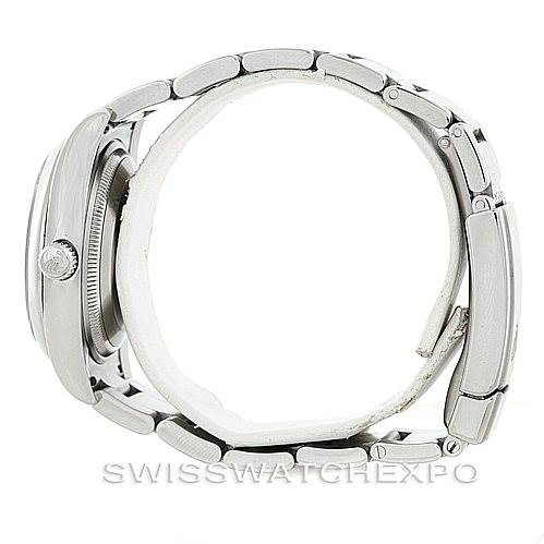 The image shows a side view of a Rolex Air-King 114200 Men's Stainless Steel Blue Dial 114200 Men's Stainless Steel Blue Dial watch, highlighting its stainless steel case, crown, and bracelet.