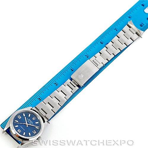 The Rolex Air-King 14000 Men's Stainless Steel Blue Dial 14000 Men's Stainless Steel Blue Dial watch is shown from an overhead angle, displaying the full face and bracelet next to a blue ruler for scale.