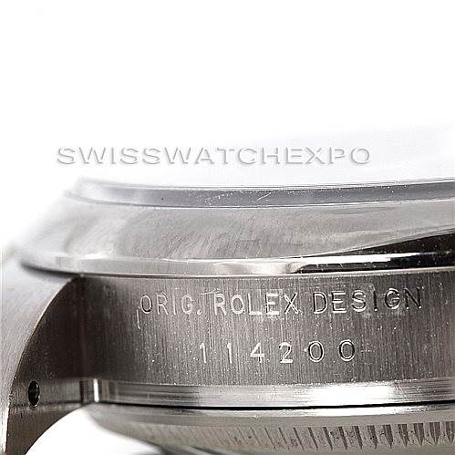 The image shows a close-up of the side case of a Rolex Air-King 114200 Men's Stainless Steel Blue Dial 114200 Men's Stainless Steel Blue Dial watch, including the "Orig. Rolex Design" engraving and model number 114200.