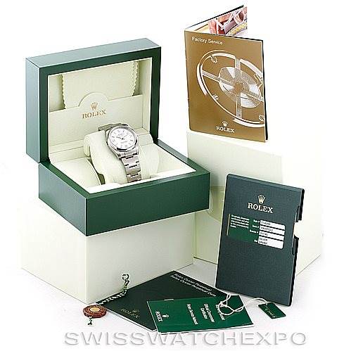 The image shows a Rolex Air-King 114200 Men's Stainless Steel Silver Dial 114200 Men's Stainless Steel Silver Dial watch in its open green box with accompanying booklets, tags, and accessories arranged around it.