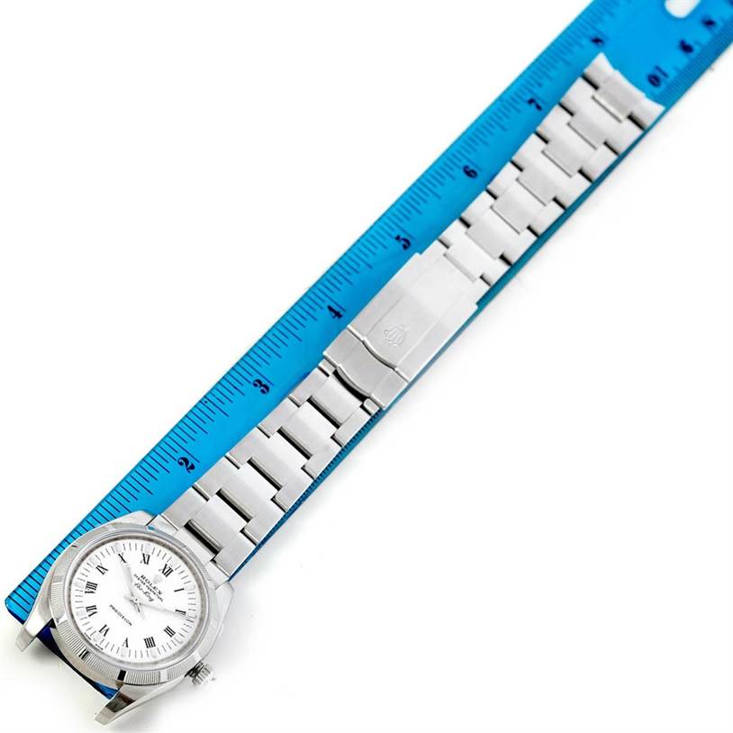 This image shows the face, bracelet, and clasp of a Rolex Air-King 114210 Men's Stainless Steel White Dial 114210 Men's Stainless Steel White Dial watch, positioned next to a ruler for measurement.