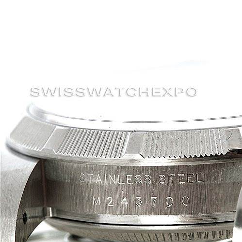 This image shows a close-up angle of the stainless steel case back and bezel of a Rolex Air-King 114210 Men's Stainless Steel White Dial 114210 Men's Stainless Steel White Dial watch.