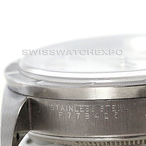 This close-up angle shows the side of a stainless steel Rolex Air-King 14010 Men's Stainless Steel Silver Dial 14010 Men's Stainless Steel Silver Dial watch case with engraved serial numbers.