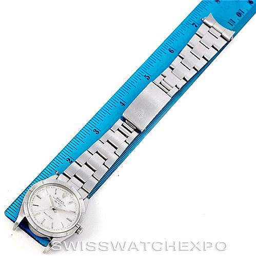 The Rolex Air-King 14010 Men's Stainless Steel Silver Dial 14010 Men's Stainless Steel Silver Dial watch is shown from an overhead angle, displaying the full bracelet and face alongside a blue ruler for scale.