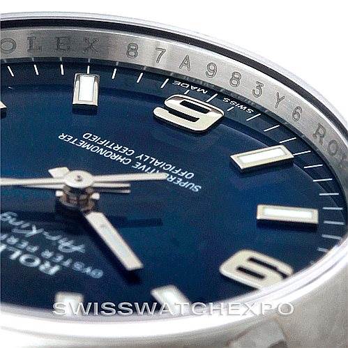 The image shows a close-up of the Rolex Air-King 114200 Men's Stainless Steel Blue Dial 114200 Men's Stainless Steel Blue Dial watch dial and part of its bezel, highlighting the hour markers and minute details.