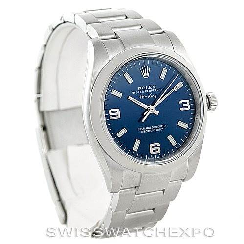 The image shows a Rolex Air-King 114200 Men's Stainless Steel Blue Dial 114200 Men's Stainless Steel Blue Dial watch from a slight side angle, highlighting its blue dial, silver bracelet, and crown.