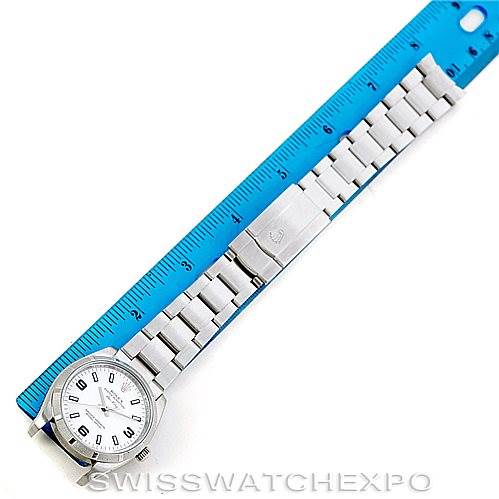 The image shows a Rolex Air-King 114210 Men's Stainless Steel White Dial 114210 Men's Stainless Steel White Dial watch laid flat beside a blue ruler, displaying the watch face and metal bracelet.