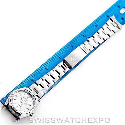 The image shows a Rolex Air-King 14000 Men's Stainless Steel Silver Dial 14000 Men's Stainless Steel Silver Dial watch laid flat next to a ruler, highlighting its face, band, and clasp.