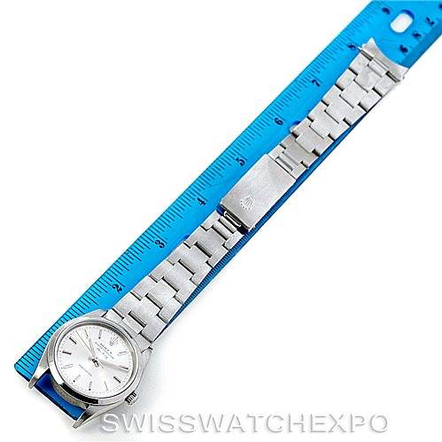 The image shows a top-down view of a Rolex Air-King 14000 Men's Stainless Steel Silver Dial 14000 Men's Stainless Steel Silver Dial watch, including its face, stainless steel bracelet, and clasp, alongside a ruler for scale.