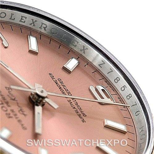 The image shows a close-up and partial side angle of the Rolex Air-King 114234 Men's Stainless Steel Pink Dial 114234 Men's Stainless Steel Pink Dial watch, highlighting its pink dial, hour markers, and bezel numerals.
