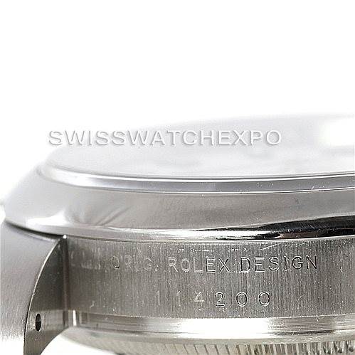 This image shows a close-up of the case side of a Rolex Air-King 114200 Men's Stainless Steel White Dial 114200 Men's Stainless Steel White Dial watch, focusing on the engraved "ORIG. ROLEX DESIGN" and the model number.