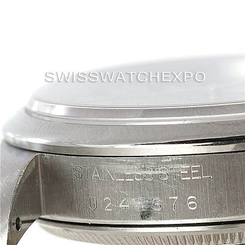 The image shows a close-up angle of the side profile of a Rolex Air-King 14000 Men's Stainless Steel Pink Dial 14000 Men's Stainless Steel Pink Dial watch, highlighting the stainless steel case and serial number.