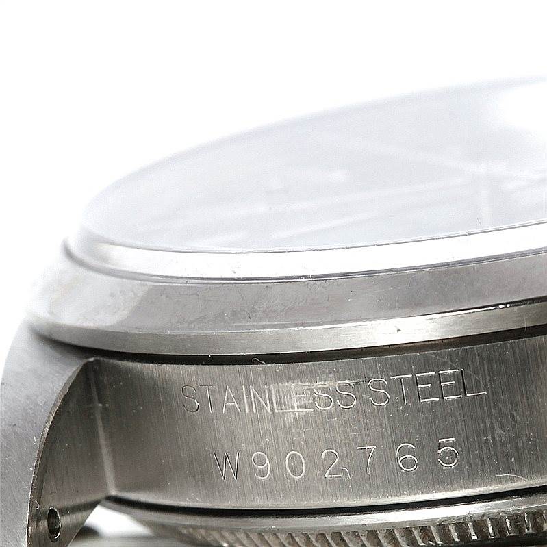 The image shows a close-up side view of the Air-King Rolex watch case, highlighting its stainless steel material and serial number.