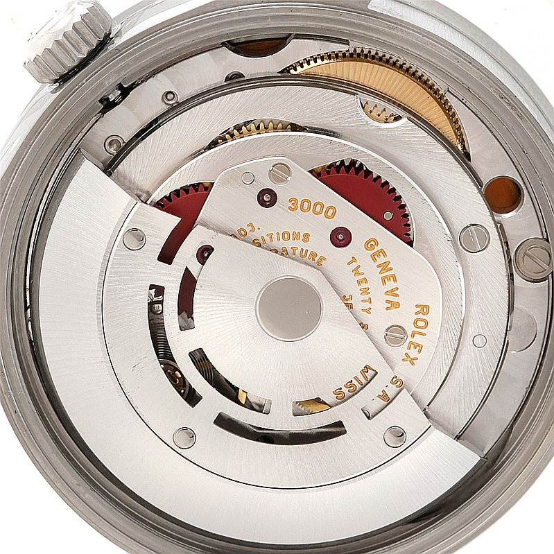 This image shows a close-up view of the mechanical movement inside a Rolex Air-King 14010 Men's Stainless Steel Blue Dial 14010 Men's Stainless Steel Blue Dial watch, highlighting the intricate gears and components.