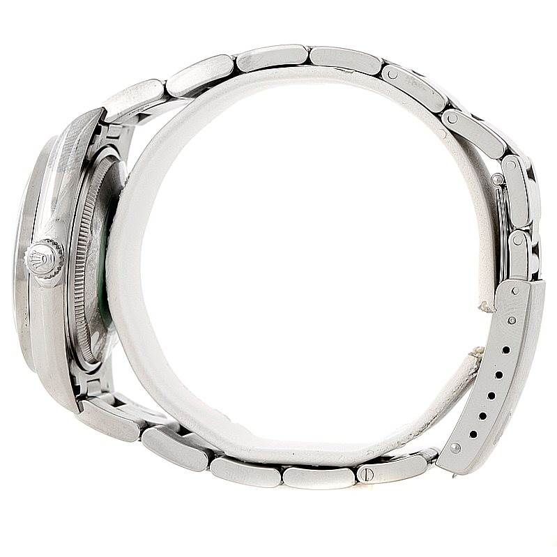 This side view of the Rolex Air-King 14010 Men's Stainless Steel Blue Dial 14010 Men's Stainless Steel Blue Dial watch shows the crown, case, and metal bracelet with clasp.