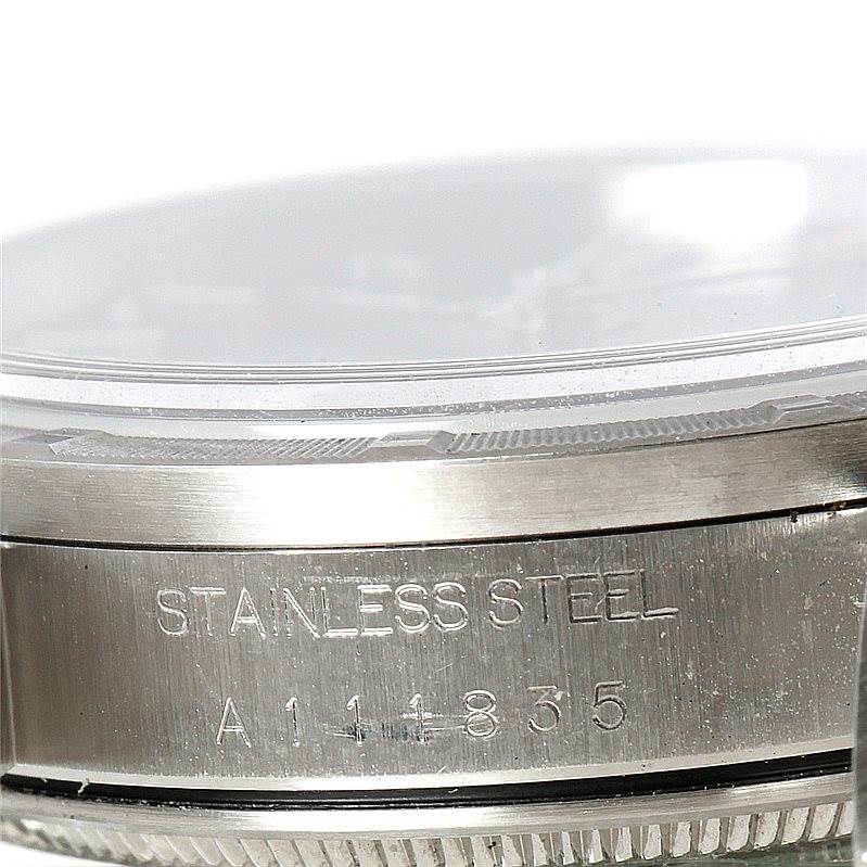 The image shows a close-up side view of the casing, specifically the edge and part of the bezel, of a Rolex Air-King 14010 Men's Stainless Steel Blue Dial 14010 Men's Stainless Steel Blue Dial watch.