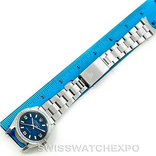 The image shows a Rolex Air-King 14010 Men's Stainless Steel Blue Dial 14010 Men's Stainless Steel Blue Dial watch laid flat, showcasing the face, band, and clasp next to a blue ruler for measurement.