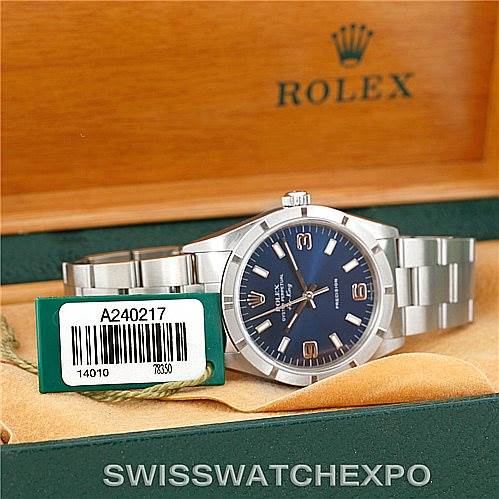 The image shows a Rolex Air-King 14010 Men's Stainless Steel Blue Dial 14010 Men's Stainless Steel Blue Dial watch at a slight angle, highlighting its face, bracelet, and box.