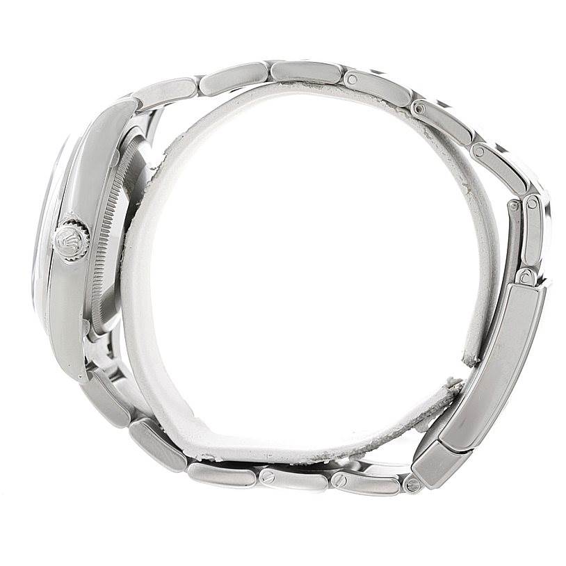 This image shows a side view of a Rolex Air-King 114200 Men's Stainless Steel Blue Dial 114200 Men's Stainless Steel Blue Dial watch, highlighting its crown, case, and stainless steel bracelet.