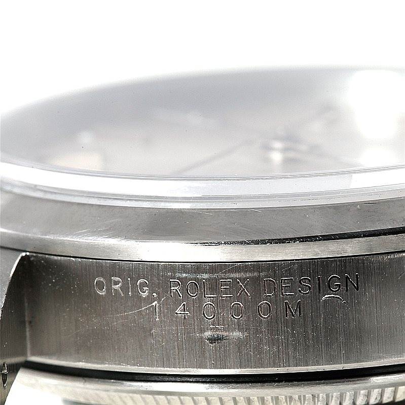 This close-up image shows the side and edge of the face of the Rolex Air-King 14000 Men's Stainless Steel Silver Dial 14000 Men's Stainless Steel Silver Dial watch, including part of the bezel and engraved text.
