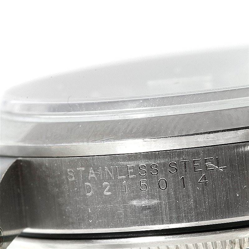 This image shows a close-up of the side of a Rolex Air-King 14000 Men's Stainless Steel Silver Dial 14000 Men's Stainless Steel Silver Dial watch, highlighting the stainless steel case and part of the crystal.