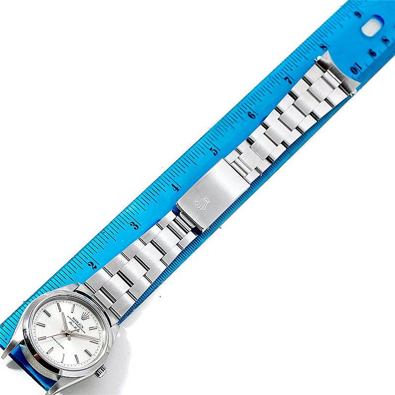 The image shows the full length of a Rolex Air-King 14000 Men's Stainless Steel Silver Dial 14000 Men's Stainless Steel Silver Dial watch laid flat alongside a ruler, highlighting the watch face, bracelet, and clasp.