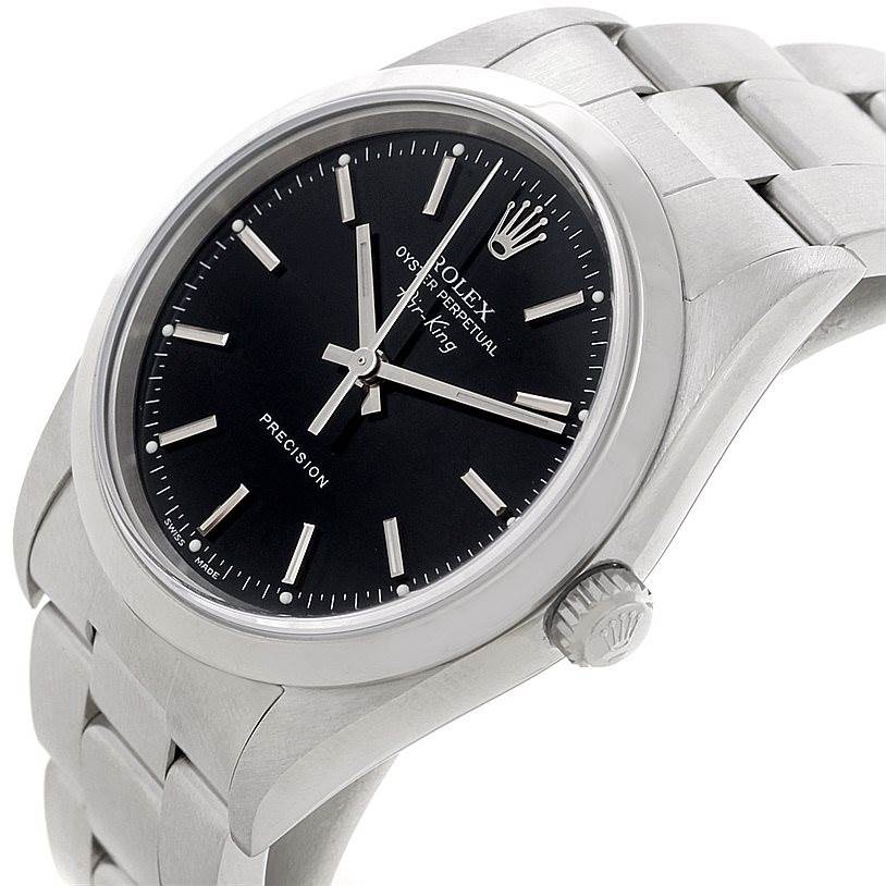 This image shows a close-up angle of the Rolex Air-King 14000 Men's Stainless Steel Black Dial 14000 Men's Stainless Steel Black Dial watch featuring its black dial, crown, and stainless steel bracelet.