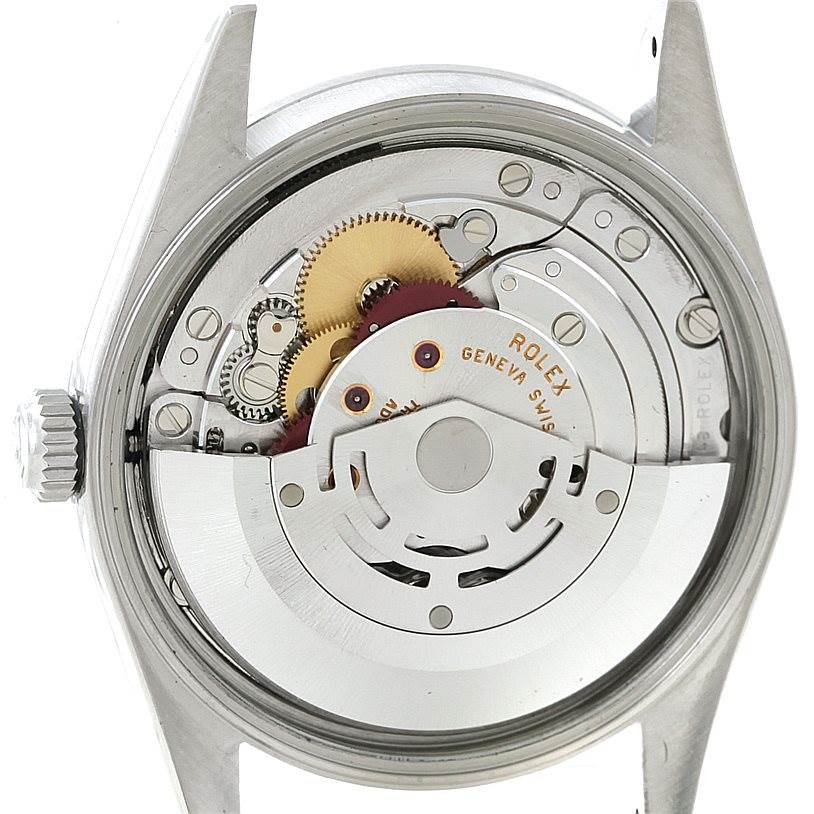 The image shows a close-up of the internal mechanism of a Rolex Air-King 14000 Men's Stainless Steel Black Dial 14000 Men's Stainless Steel Black Dial watch, displaying gears and the rotor.