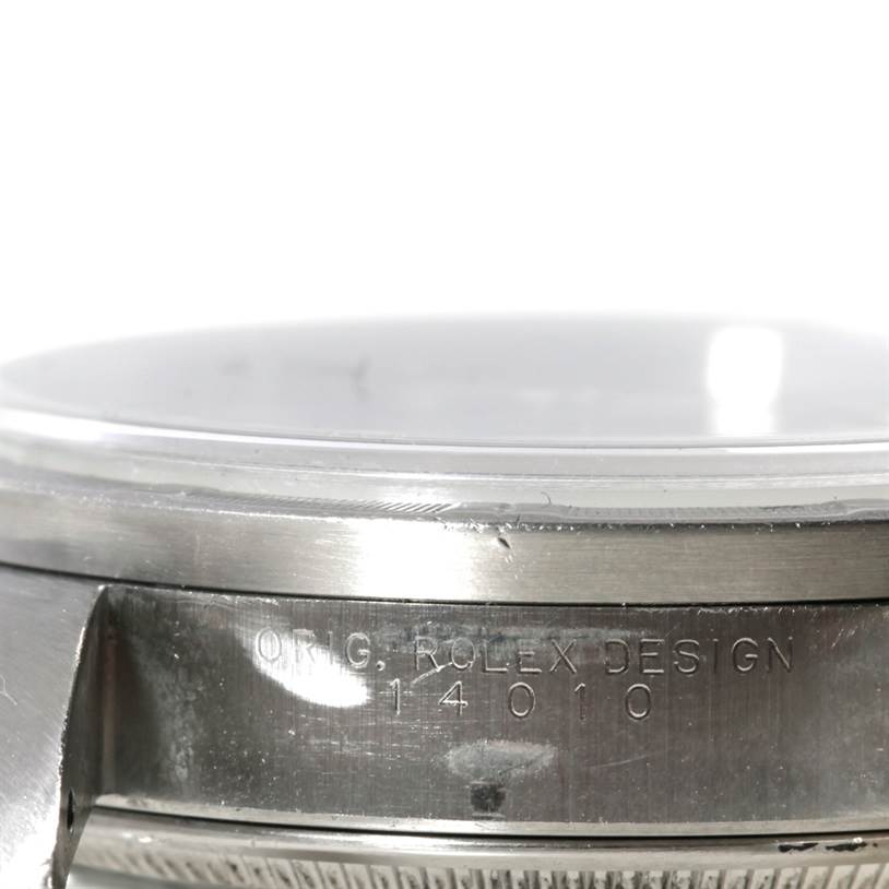 This image shows a close-up of the case side and crystal of a Rolex Air-King 14010 Men's Stainless Steel Blue Dial 14010 Men's Stainless Steel Blue Dial watch, displaying the engraved model number.