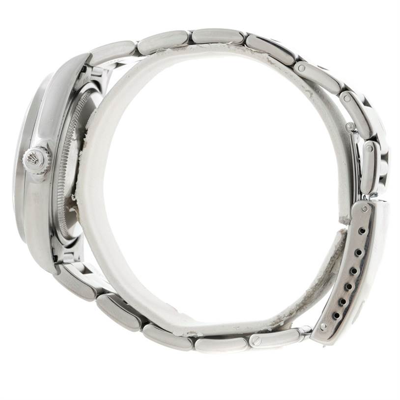 The image shows the side profile of a Rolex Air-King 14010 Men's Stainless Steel Blue Dial 14010 Men's Stainless Steel Blue Dial watch, highlighting the crown, case, and bracelet.