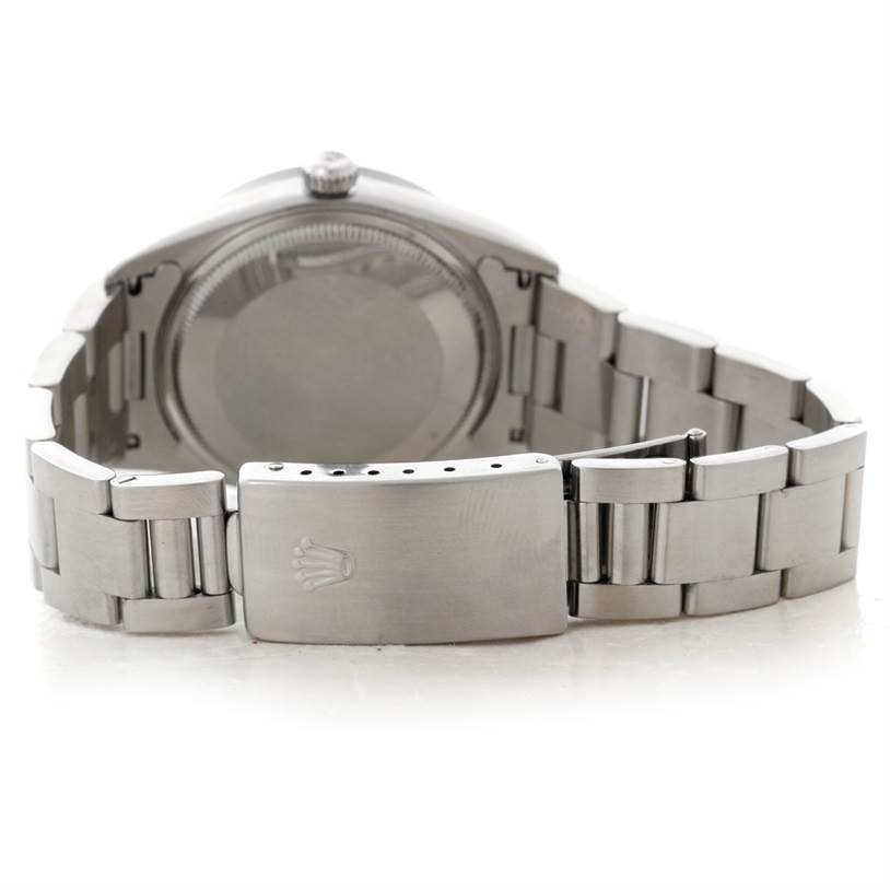 The image shows the back and clasp of a Rolex Air-King 14010 Men's Stainless Steel Blue Dial 14010 Men's Stainless Steel Blue Dial watch, including the stainless steel bracelet and closed case back.