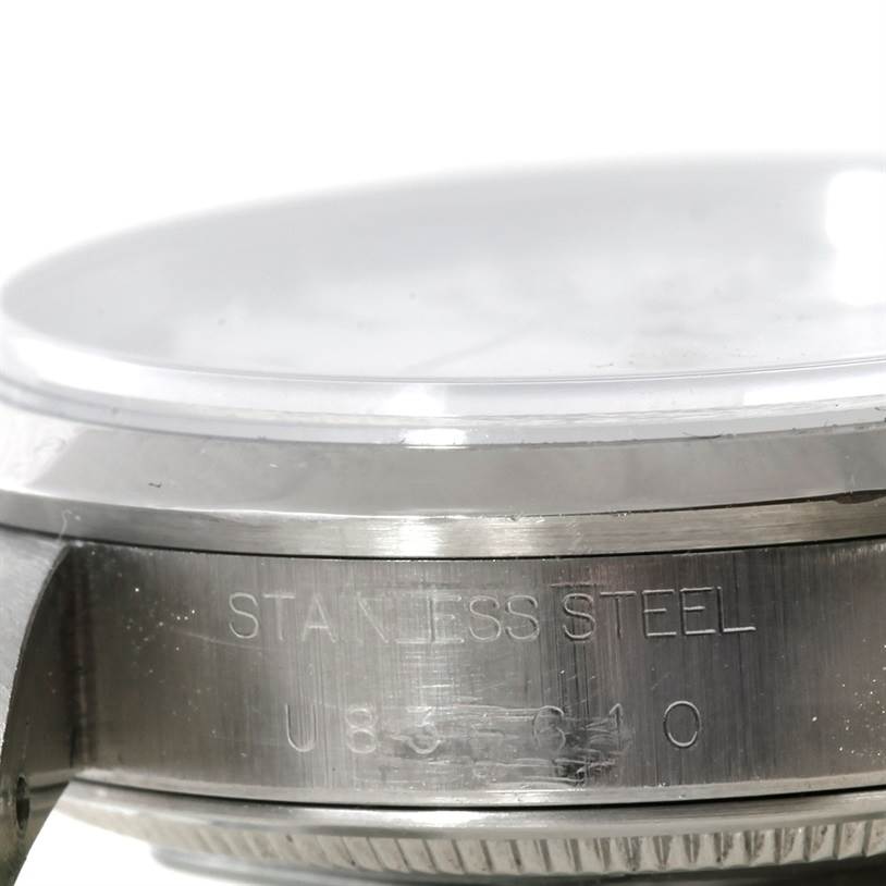 This is a close-up view of the side of a stainless steel Rolex Air-King 14000 Men's Stainless Steel White Dial 14000 Men's Stainless Steel White Dial watch case showing the engravings.