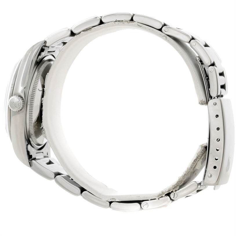 The image shows a side view of a Rolex Air-King 14000 Men's Stainless Steel White Dial 14000 Men's Stainless Steel White Dial watch, featuring its clasp, bracelet links, and winding crown.